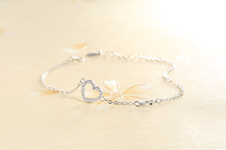 Tiny diamond-studded heart bracelet